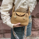 Side view of considered structured handbag