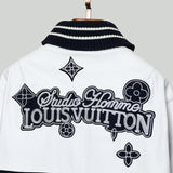 Back view of Louis Vuitton luxury clothing with label-forward styling
