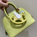 Side view of clean-lined structured handbag