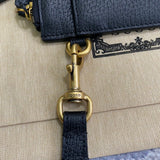 Handle and strap detail of everyday-luxe polished women's handbag – women's designer-style accessory