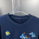 Close-up detail shot of Louis Vuitton luxury clothing with label-forward styling