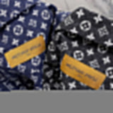 Close-up detail shot of Louis Vuitton luxury clothing with logo-detail design