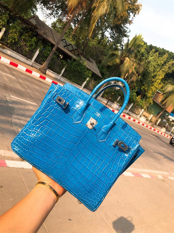  Timeless top-handle bag carried on shoulder