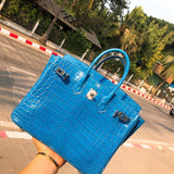  Timeless top-handle bag carried on shoulder