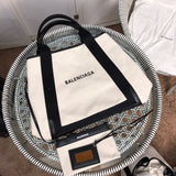 Back view of chic elevated women's handbag – women's statement bag