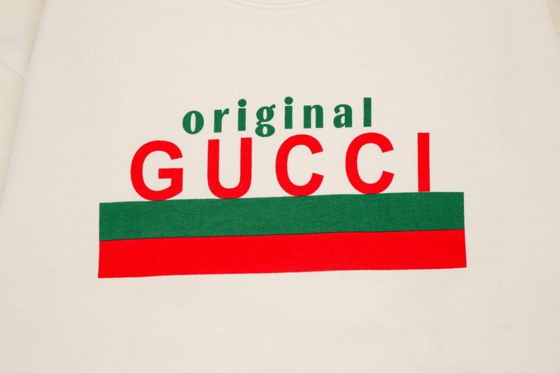 Flat lay presentation of Gucci luxury clothing with contemporary cut
