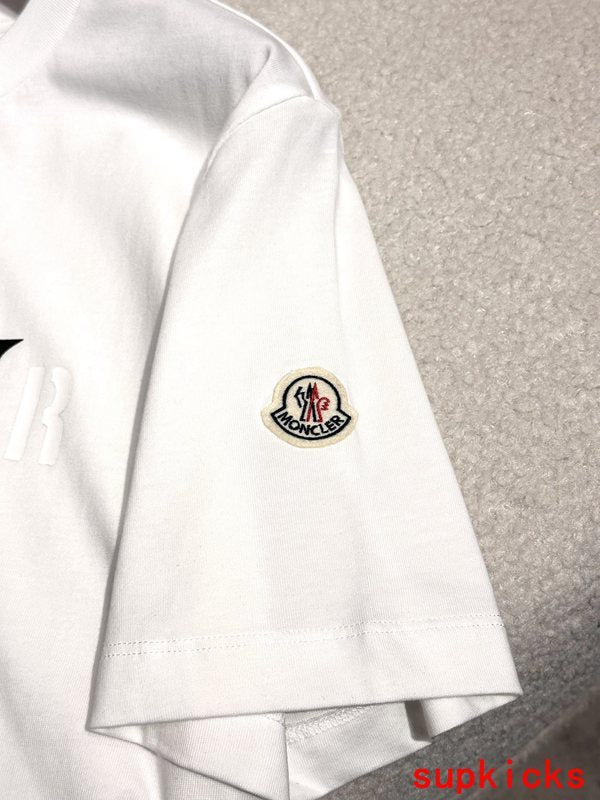 Full styled look of Moncler luxury clothing with monogram-inspired silhouette