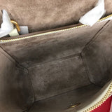 Side profile of statement structured women's handbag – women's luxury accessory