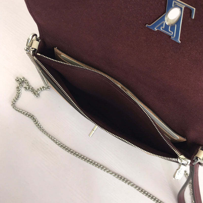 Side profile of polished premium women's handbag – women's luxury handbag