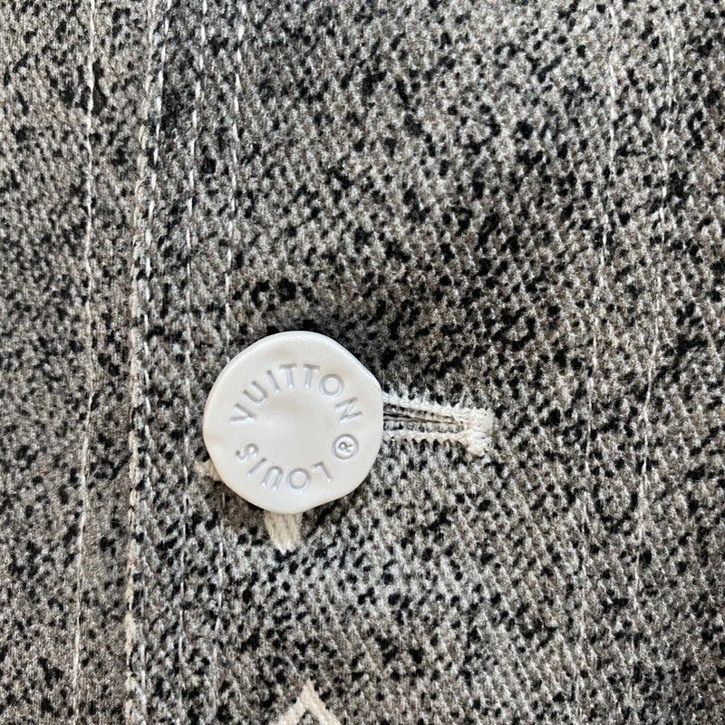 Close-up detail shot of Louis Vuitton luxury clothing with monogram-inspired silhouette