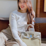 Side view of everyday-ready structured handbag