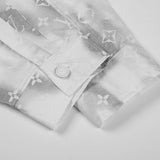 Side profile of Louis Vuitton luxury clothing with logo-detail design