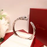 Side view of Cartier unisex jewelry piece