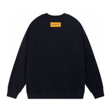 Back view of Louis Vuitton luxury clothing with signature branding