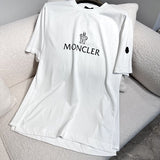 Back view of Moncler luxury clothing with monogram-inspired silhouette