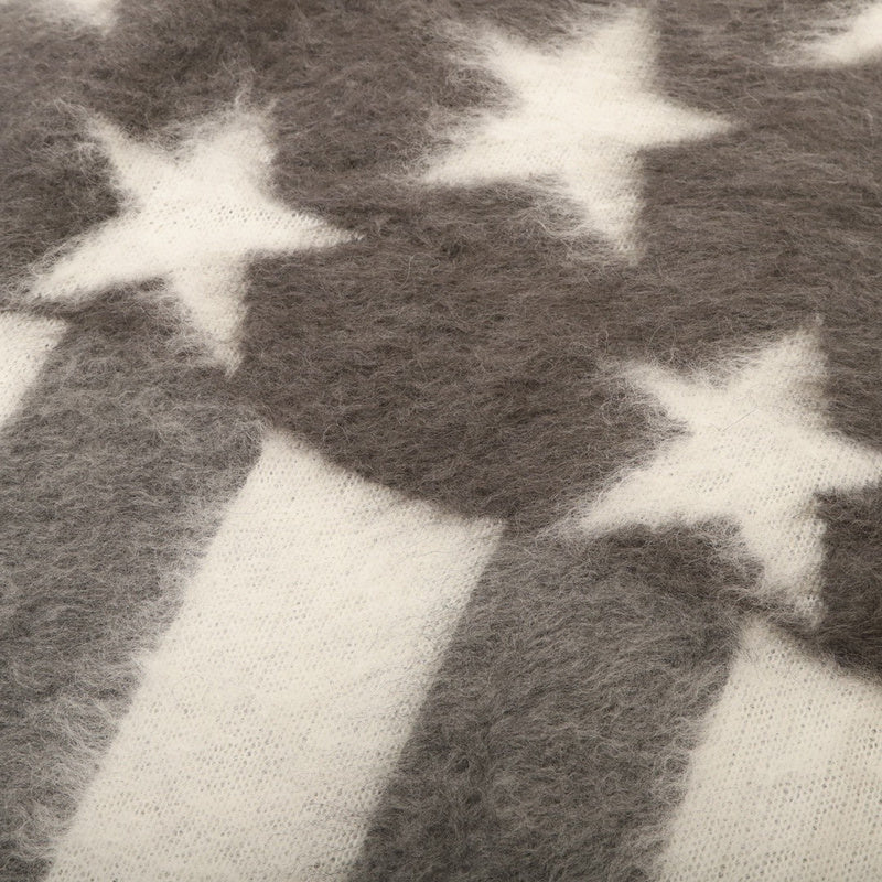 Close-up detail shot of Louis Vuitton luxury clothing with logo-detail design