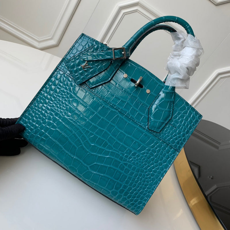 Side profile of modern polished women's handbag – women's statement bag