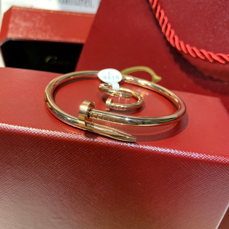 Side view of Cartier unisex jewelry piece