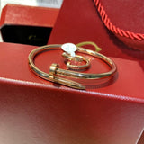Side view of Cartier unisex jewelry piece
