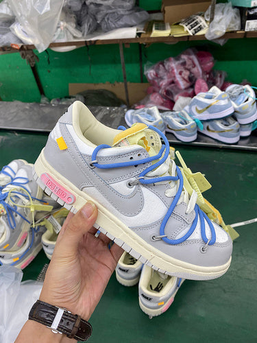 Side profile of Nike classic monochrome sneakers low-top design