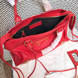 Close-up detail of polished statement women's handbag – women's designer-style accessory