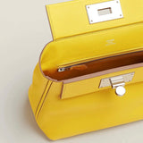 Side view of tailored structured handbag