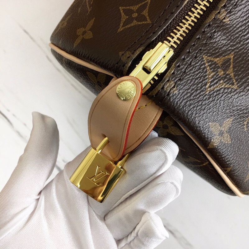 Side profile of signature polished women's handbag – women's luxury handbag