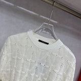 Flat lay presentation of Louis Vuitton luxury clothing with streetwear-inspired cut