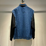 Side profile of Louis Vuitton luxury clothing with logo-detail design