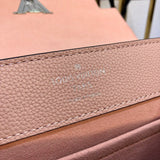 Side profile of structured signature women's handbag – women's statement bag