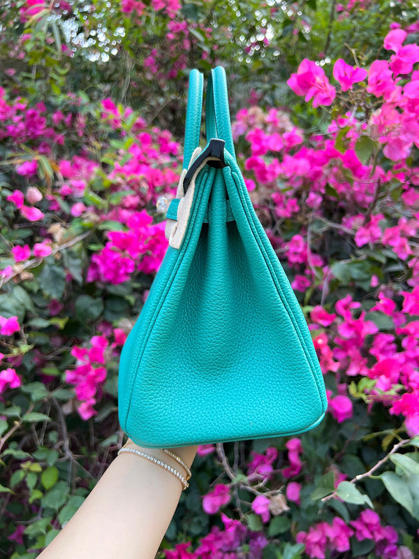 Side view of sculpted structured handbag