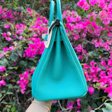 Side view of sculpted structured handbag