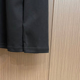 Back view of Louis Vuitton luxury clothing with tailored silhouette