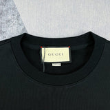 Close-up detail shot of Gucci luxury clothing with signature branding