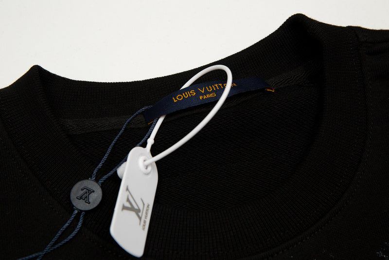 Flat lay presentation of Louis Vuitton luxury clothing with signature branding
