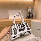Ziva's Charm handbag – back view (one versatile size)