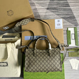 Styled lifestyle shot of refined classic women's handbag – women's luxury handbag