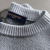 Front view of Louis Vuitton luxury clothing with signature branding