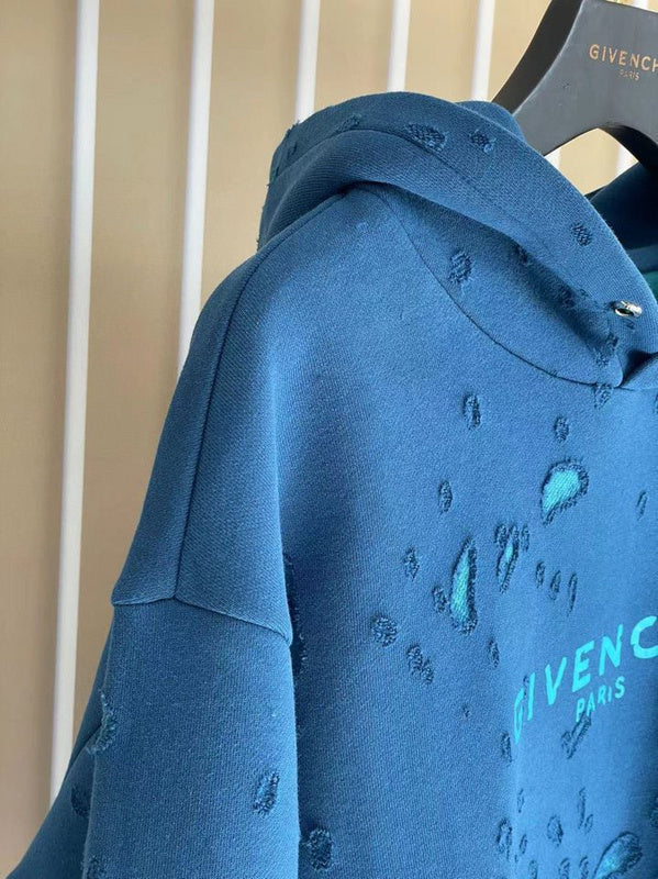 Close-up detail shot of Givenchy luxury clothing with logo-detail design