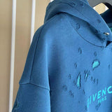 Close-up detail shot of Givenchy luxury clothing with logo-detail design