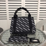 Front view of polished structured women's handbag – women's statement bag