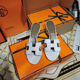 Hermes sandals Style 018 - close-up of bold signature style