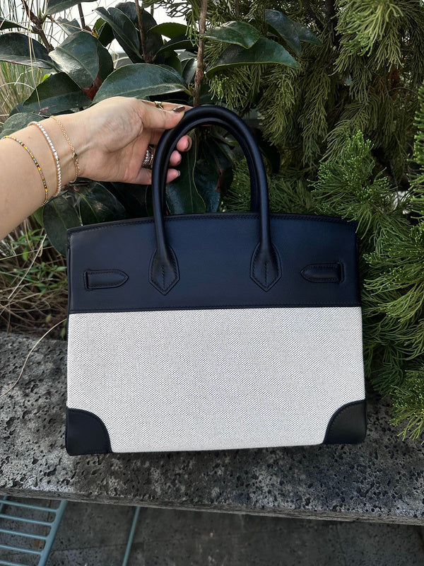 Side view of streamlined structured handbag