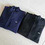 Back view of Lacoste luxury clothing with monogram-inspired silhouette