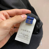 Back view of Louis Vuitton luxury clothing with everyday silhouette