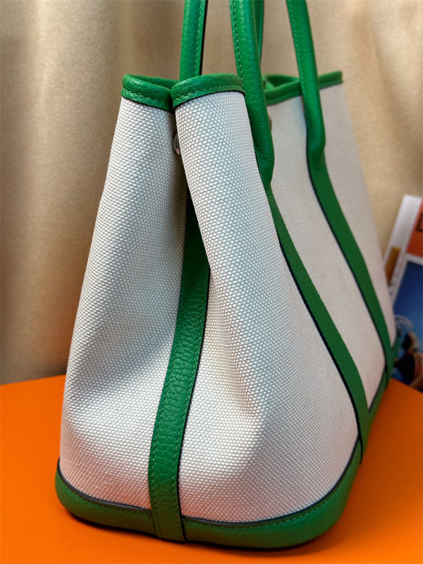  understated top-handle bag styled with outfit
