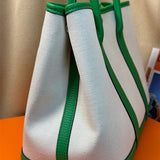  understated top-handle bag styled with outfit