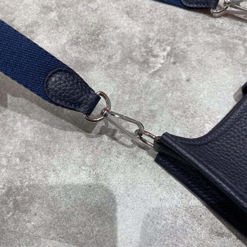 Side view of minimalist structured handbag