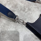 Side view of minimalist structured handbag