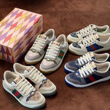Side profile of Gucci soft grey sneakers classic court silhouette